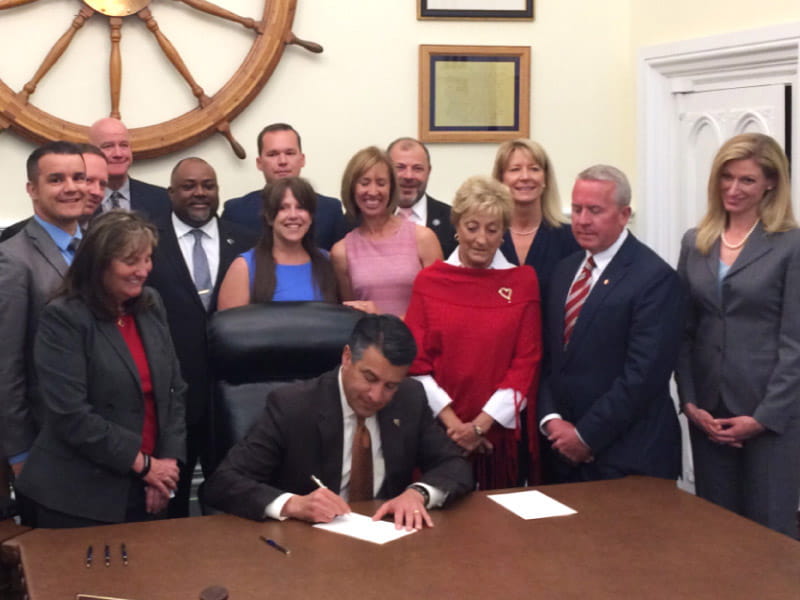 Representatives from the American Heart Association’s You’re the Cure grassroots network join Nevada state legislators and then-Gov. Brian Sandoval on May 15, 2017, in Carson City as he signs Assembly Bill 85 into law. 