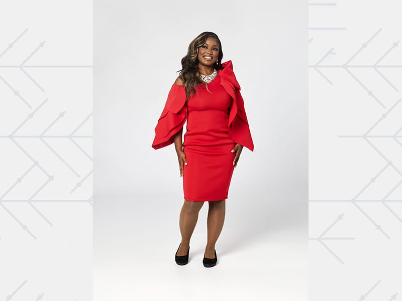 portrait of Taelur Littlejohn, dressed in red, as a member of the American Heart Association’s 2025 Go Red for Women Class of Survivors