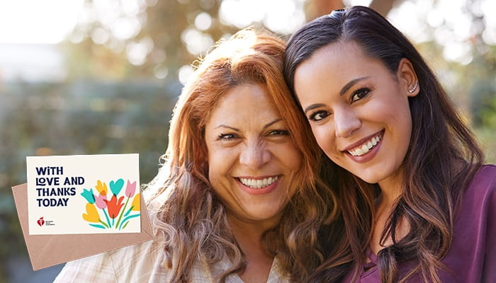 Two women smiling for the camera with eCard logo