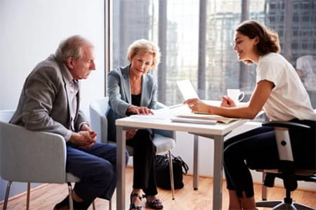 older couple meeting with professional advisor about finances