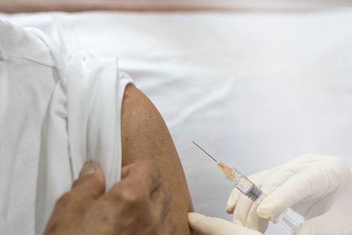 Elderly person getting vaccine