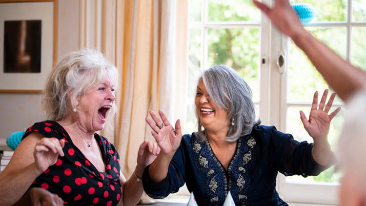 A group of mature women celebrating.