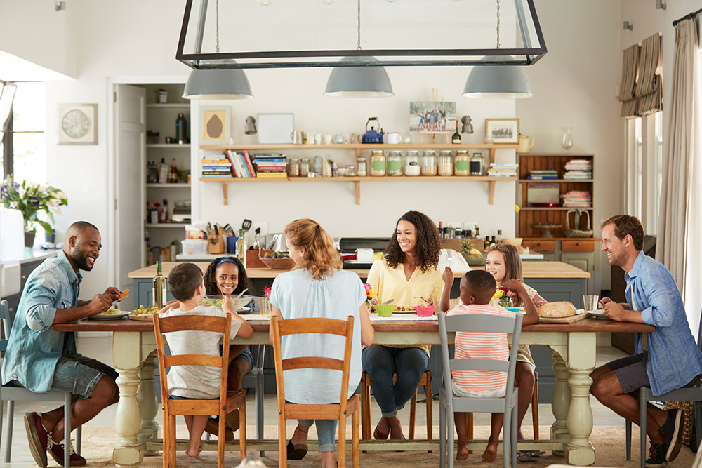 multicultural family eating meal