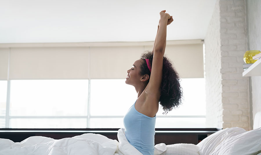 Ease into the Morning with Bed Yoga - The Monday Campaigns