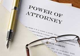 close up of document on desk titled "Power of Attorney"