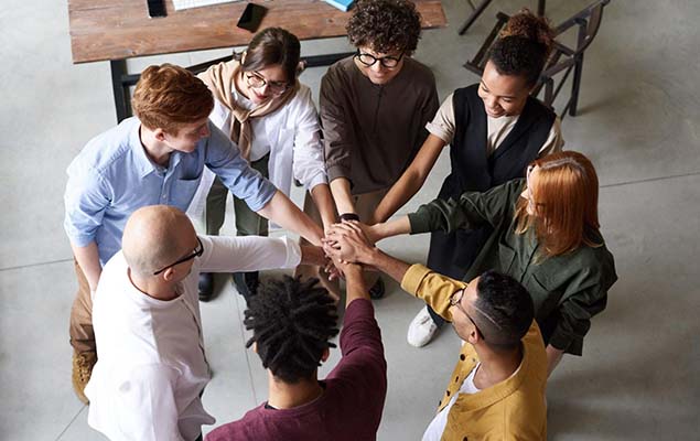 group with hands in