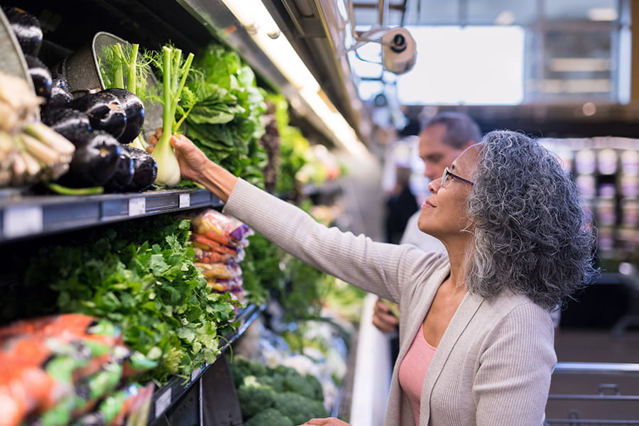 woman shopping fresh produce in store