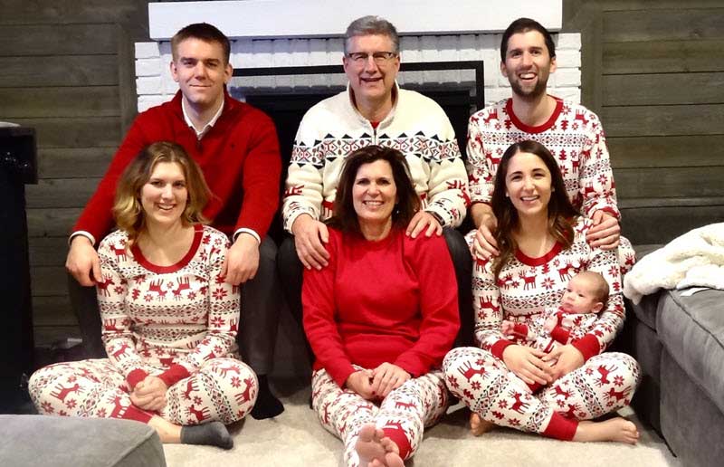 Jim Abraham with family in Christmas pajamas