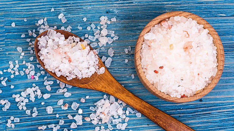 pink salt on blue background