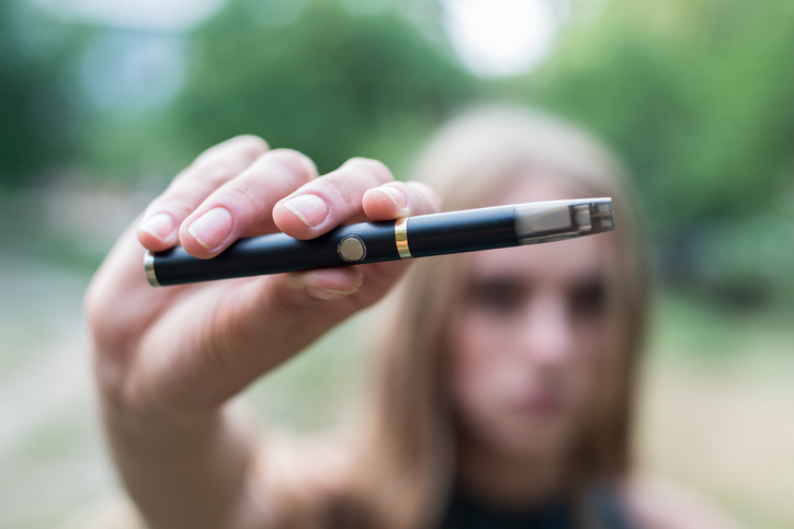 Girl holding a vape pen