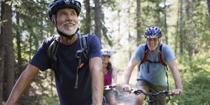 Couple riding bikes on a trail