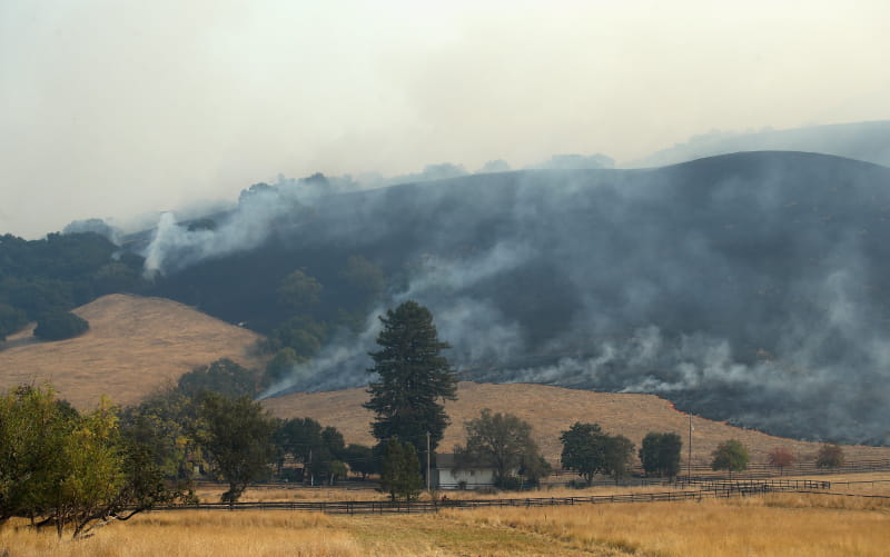 Wildfire threatens a house on the ouskirts of Santa Rosa, California on October 11, 2017. (Ezra Shaw/Staff, Getty Images News)