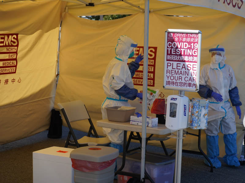 Medical staff at North East Medical Services’ Eastmoor Clinic in Daly City, California, prepare for the day’s drive-thru COVID-19 testing appointments. (Photo by Shawn Gu/North East Medical Services)