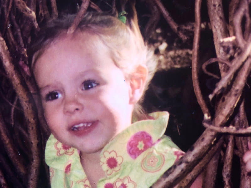 Less than two weeks before her accident, Abbie Vara rode a swing in the vines of a banyan tree on a Waikiki beach, proudly wearing a favorite new dress. (Photo courtesy of the Vara family)