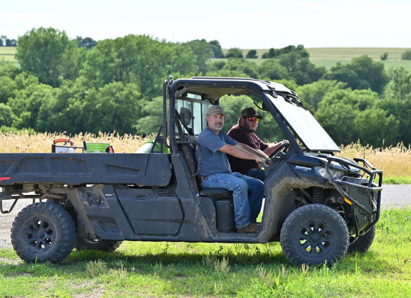 Consultant Eric Fuchs (left) works with the tribe and Ioway Farms manager Kyle Rhodd (right) on the shift to regenerative agriculture. (Photo by Walter Johnson Jr./American Heart Association)
