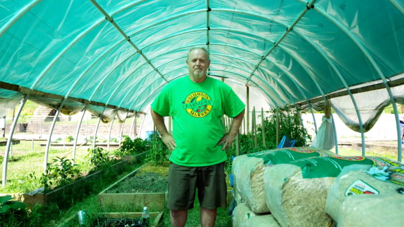 Tony Delong got his diabetes and blood pressure under control with help from the community health workers at the Williamson Health and Wellness Center. He now volunteers with the Williamson community garden. (Photo by Mark Birnbaum Productions/American Heart Association)