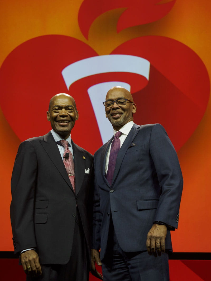 American Heart Association president Dr. Keith Churchwell presents Dr. Herman Taylor Jr. (right) with the AHA's Clinical Research Prize at its Scientific Sessions conference in Chicago in November 2024. (Photo by American Heart Association/Todd Buchanan)