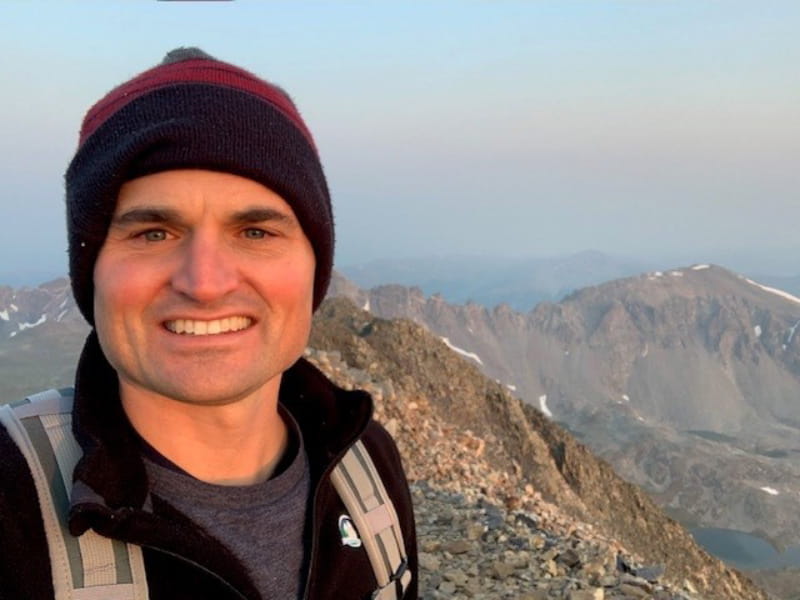 Dr. William K. Cornwell on the 14,271-foot summit of Quandary Peak, near Breckenridge, Colorado in August 2020. (Photo courtesy of Dr. William K. Cornwell)