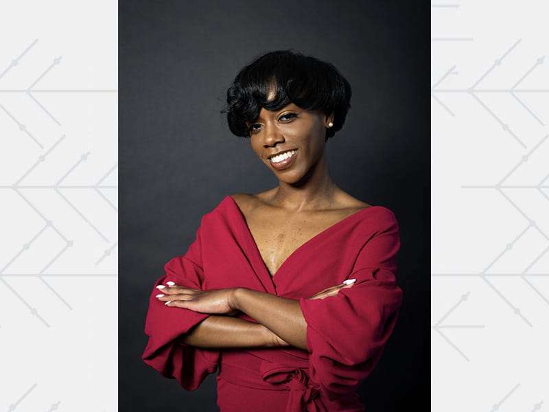 Portrait of Whitney Johnson, smiling, who was born with a heart murmur and later underwent heart surgery.