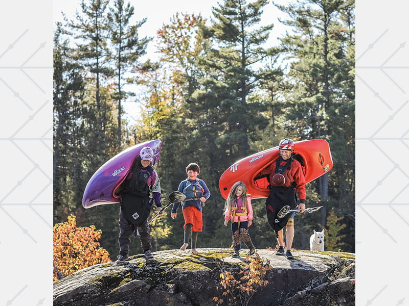 Nick Troutman walking along the Ottawa River in Canada with his wife, Emily, and their children, son Tucker and daughter Parker