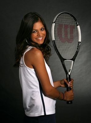 Vandana holding a tennis racquet