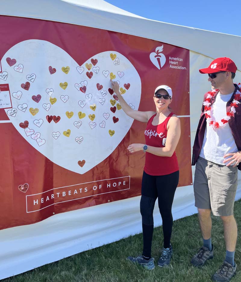 Heart attack survivor Carrie Lehtonen (left) at the Denver Heart Walk in 2024 with her husband, John Busch. (Photo courtesy of Bunnie Busch)