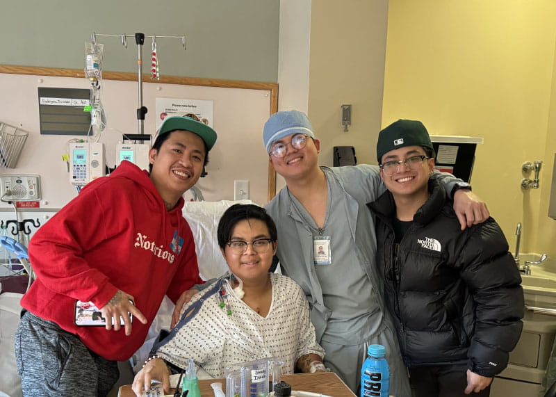 Jio Rodriguez during a visit from his brothers while recovering in the hospital after heart surgery in February 2024. From left: John, Jio, Brian and Byronn Rodriguez. (Photo courtesy of Jio Rodriguez)