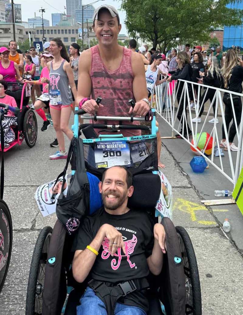 Jason Shaw pushes Chris Kemp to finish a half-marathon in Indianapolis in May 2024, three years after Shaw's heart attack. (Photo courtesy of Jason Shaw)