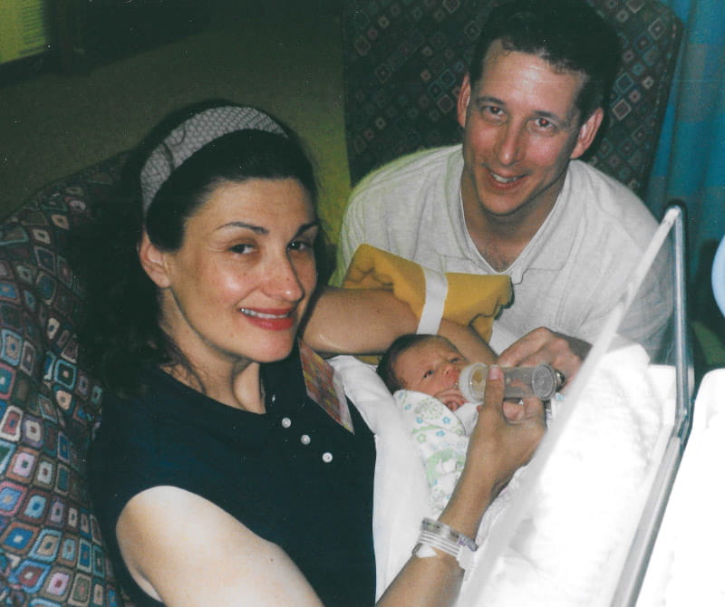 Debi (left) and Brian Corrigan hold newborn Zoe as she recovers from open heart surgery.  (Photo provided by the Corrigan family)