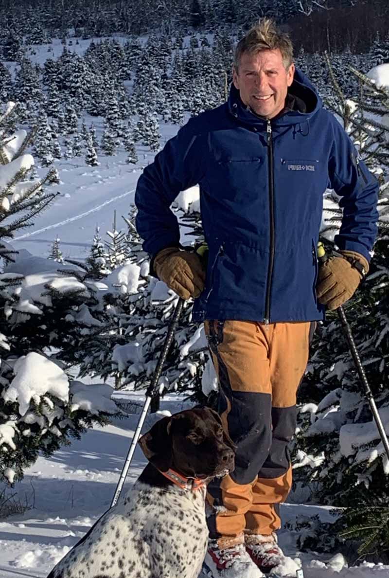 Michael Loughran and his dog, Bourbon, on the Christmas tree farm. (Photo courtesy of the Loughran family)