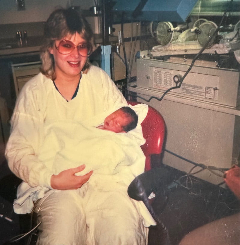 Dana Archer holding Chris Kidwell as an infant. Chris' aorta and pulmonary artery were switched, and at 6 days old he had an operation to fix the defect. (Photo courtesy of Chris Kidwell)