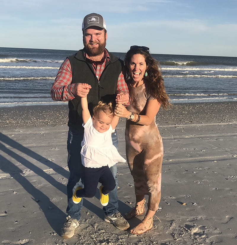 Whitney Spotts (right) with her husband, Eric, and daughter, Stella. (Photo by Dee Ahern)