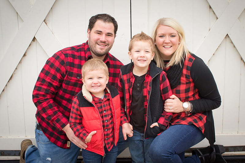 Lucy Henglefelt balances being a wedding planner and caring for her two young boys. From left: Her husband Adam, sons Tate and Cooper, and Lucy. (Photo by Luze Images)