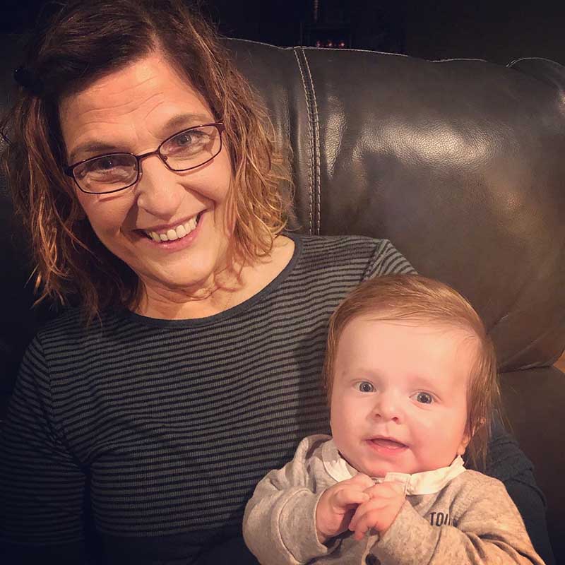 Dona Koster with one of her grandchildren. (Photo courtesy of Dona Koster)