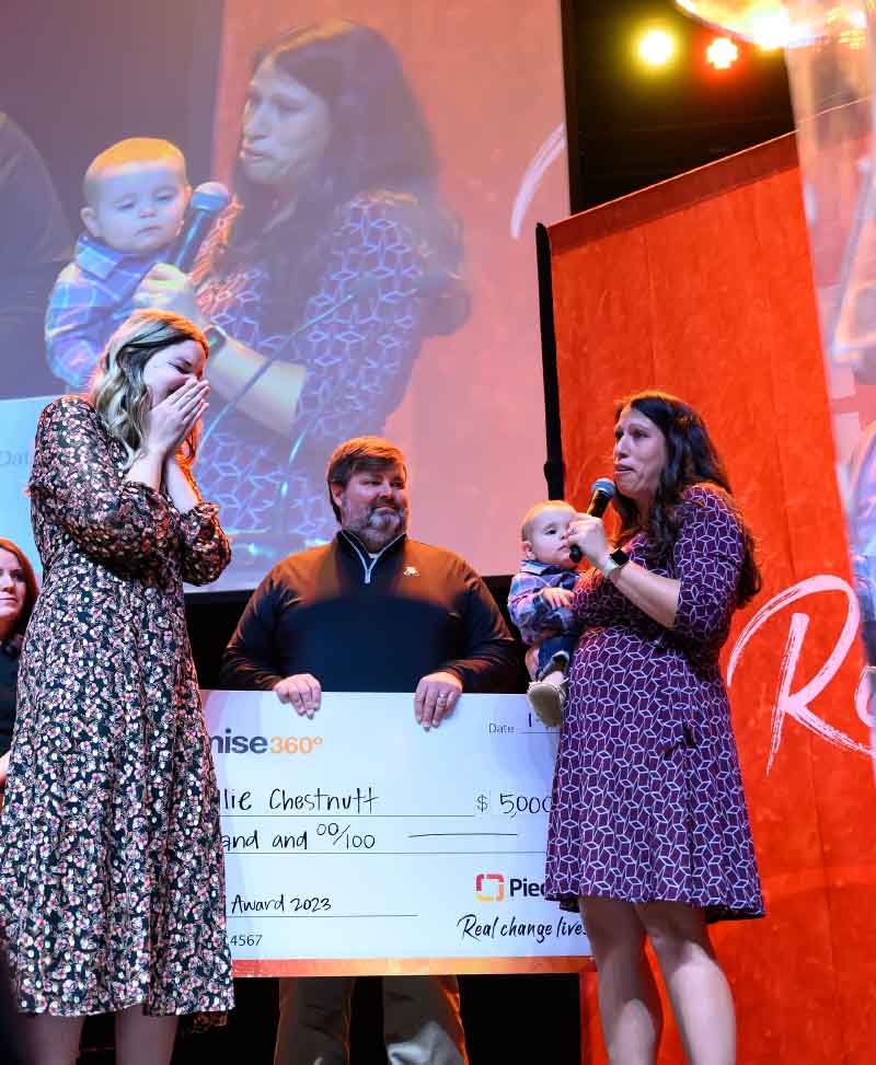 Hallie Allison (far left) was presented with her hospital's Presidential Award, where the Stewart family made a surprise appearance on stage. (Photo courtesy of Hallie Allison)