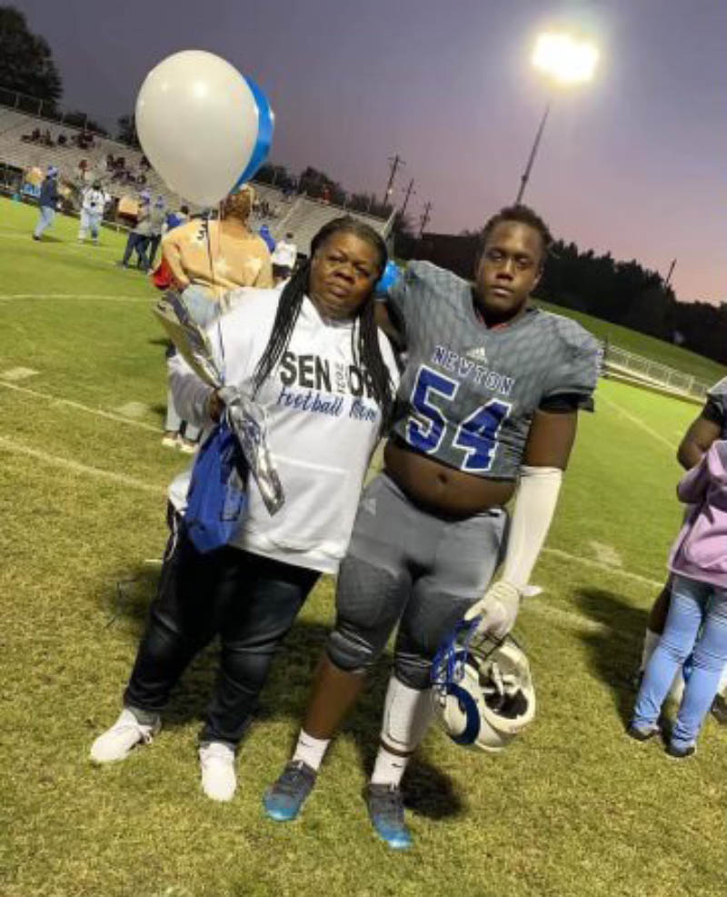 Jaden Blackwell (right) at a football game with his mom, Beverly. (Photo courtesy of the Blackwell family)