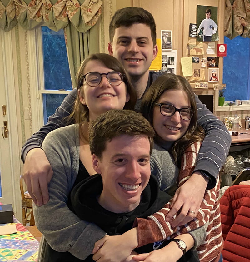 Max (top), Rebecca (gray sweater), Sarah (striped shirt) and Alex (seated) during the early days of sheltering in place. (Photo courtesy of Dr. Stacey Rosen)