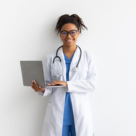 Black woman physician holding laptop