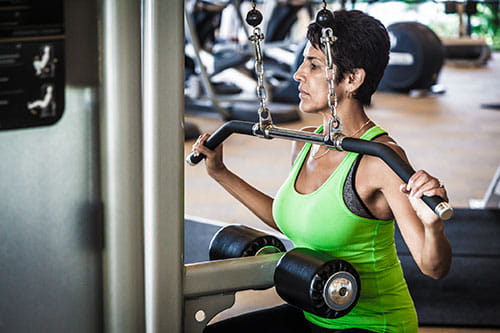 Middle aged woman lifting weights