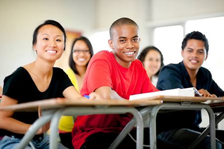high school students sitting at desks in classroom high school students sitting at desks in classroom