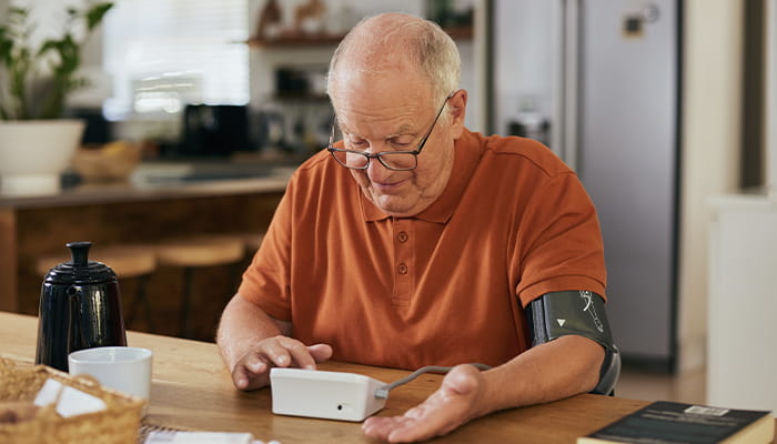 Man measuring his blood pressure