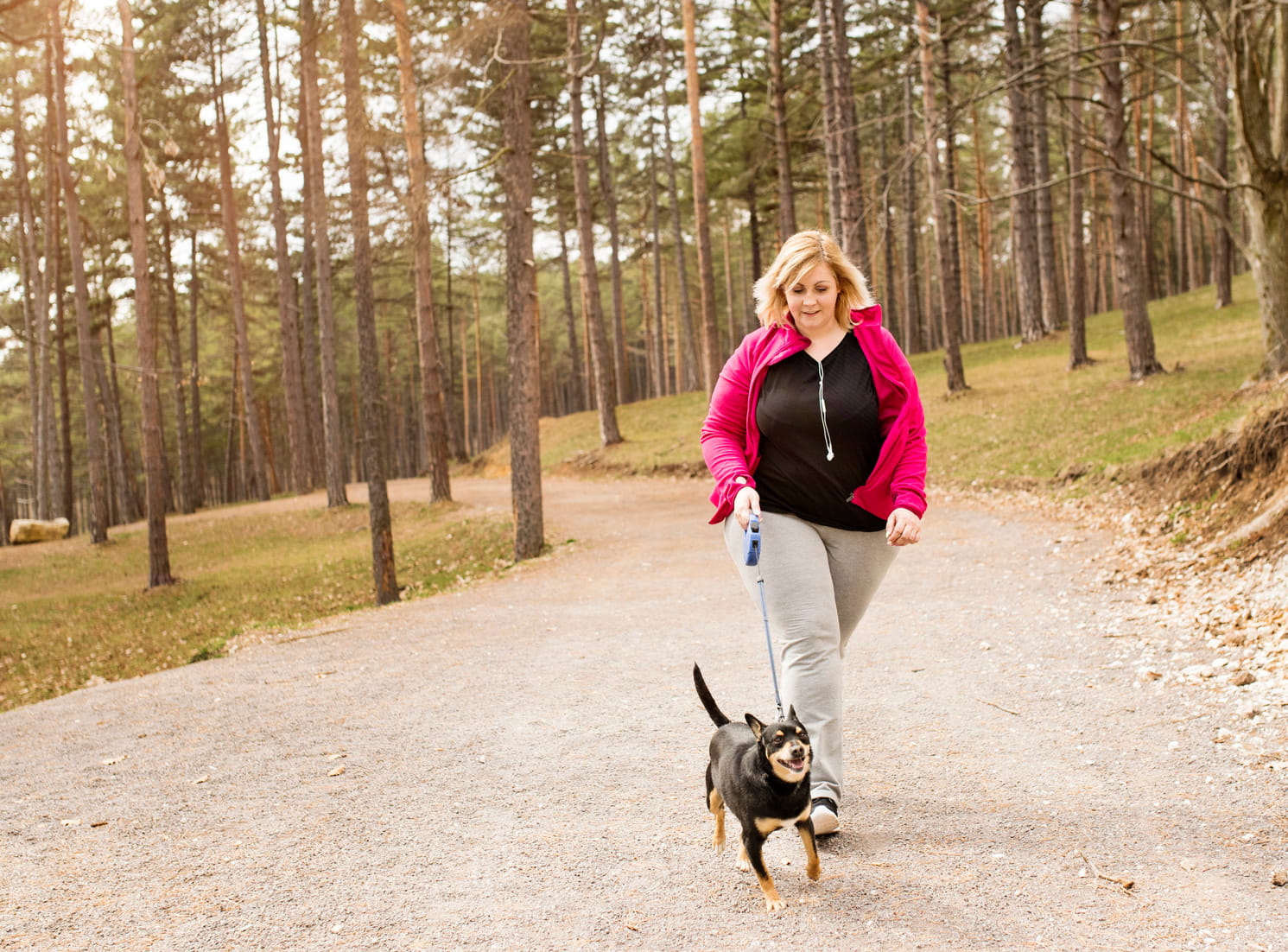 woman exercising with dog