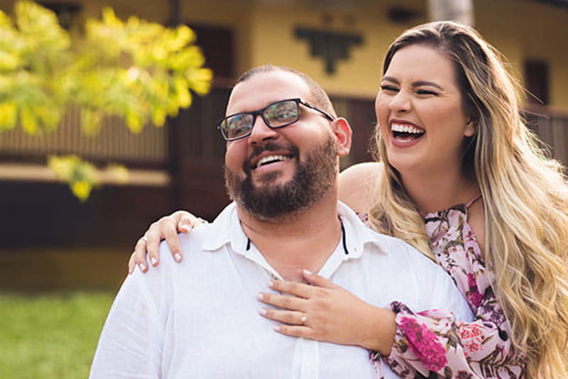 Embracing couple laughing