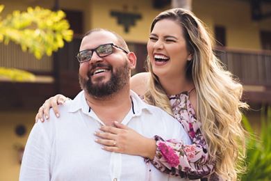 Embracing couple laughing