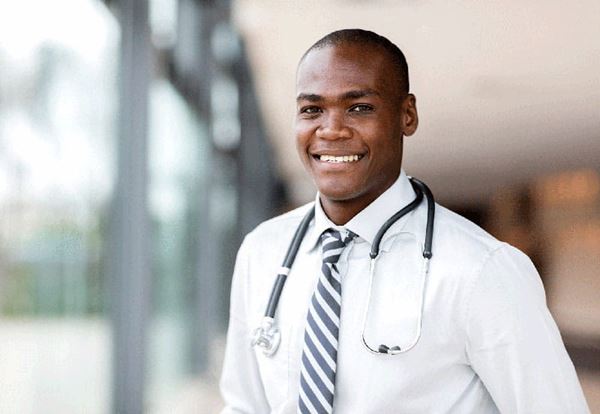 smiling young doctor wearing stethoscope smiling young doctor wearing stethoscope