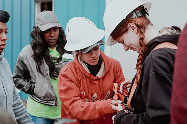 A group of West Virginia Women Work participants are gearing up with safety equipment for a job assignment. A group of West Virginia Women Work participants are gearing up with safety equipment for a job assignment.